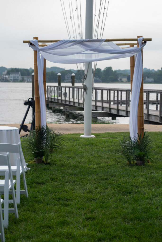 Chuppah-drapery-white-beautiful-wedding-long-island-sound-norwalk-ct-the-shore-and-country-club-fairfield-county-waterfront-cocktail-reception-roses-pink-anemone-garden-design-english-anemone-coral-reception-outdoor-connecticut-westchester