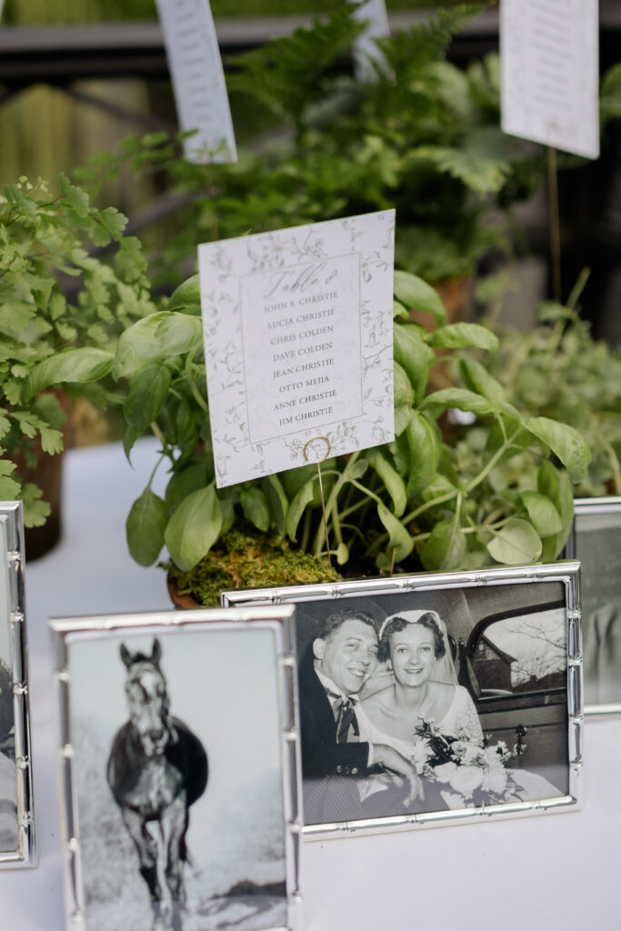 English-garden-wedding-historic-venue-white-and-green-floral-design-stunning-flowers-roses-connecticut-wedding-westchester-wedding-New-York-City-wedding-white-roses-wedding-bouquet-ranunculus-ferns-Ridgefield-memory-table
